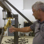 Norbert Beaujot, president of SeedMaster, explains a test procedure inside the company’s R&D shop.
