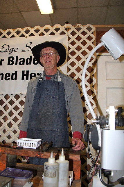Roy Herbach of Moose Jaw, Sask., sharpens blades on the Canadian Western Agribition show grounds.
