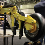 A pivot point in the opener arm allows the packer wheel to settle into the proper position in the seed trench, even when making turns in the field.