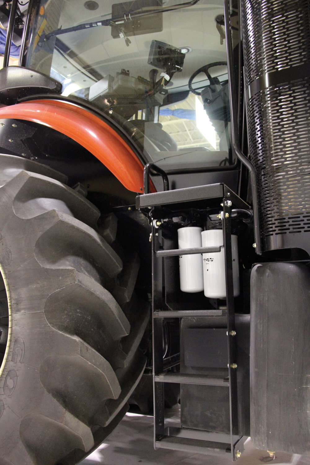 A quick release allows these steps to be folded out of  the way to allow access to oil filters.