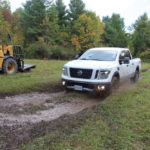 The Nissan Titan takes a dive headlong into the mud.