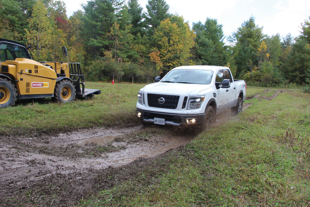 The Nissan Titan takes a dive headlong into the mud.