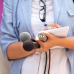 Reporter. Taking notes. Media interview.