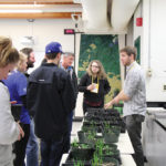 Ian Epp of the Canola Council walks CanoLAB participants
through soil residual herbicide injuries.