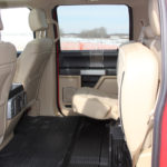 The rear seats fold up to provide cargo space. There are additional 
storage compartments under them as well.