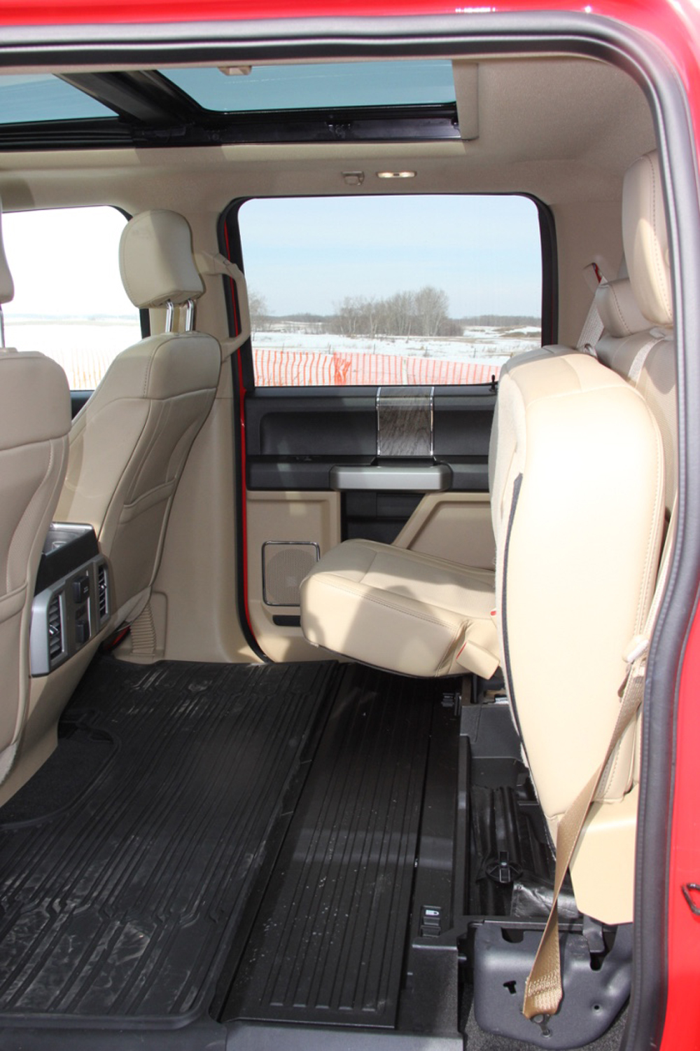 The rear seats fold up to provide cargo space. There are additional 
storage compartments under them as well.
