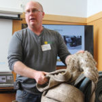 Ron Krahn shows students a damaged recovery strap that is no longer safe to use.