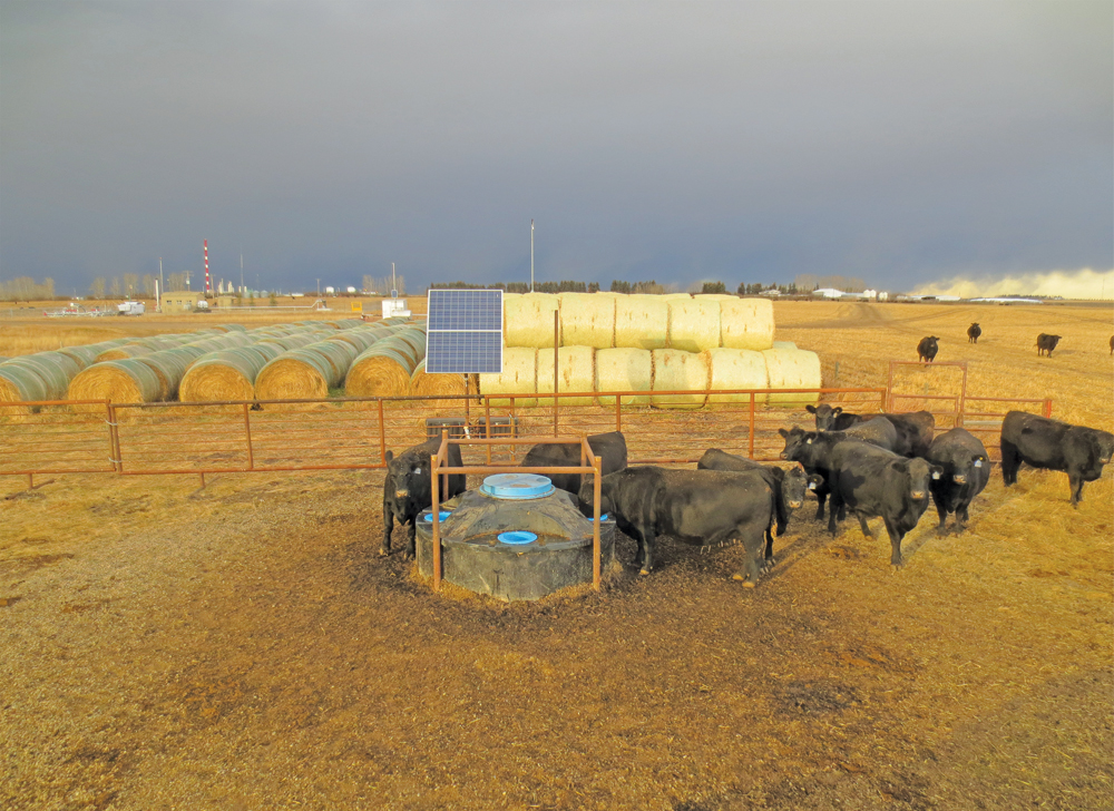 This is a completed year-round CAP Solar system over a cased well. Systems can be designed to supply anything from a few horses to a 500-head cow herd.
