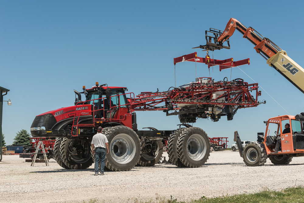 A telehandler can be used to lift bodies on and off the chassis.