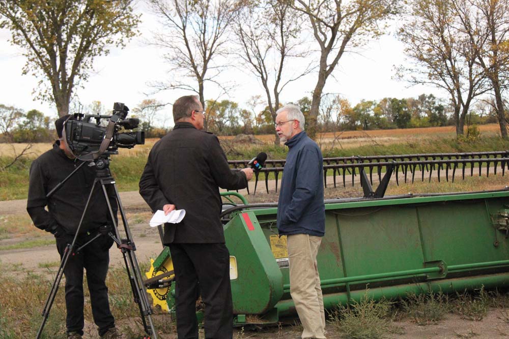 John Longhurst, director of resource and public engagement for the Canadian Foodgrains Bank, speaks to local media at the harvest event on October 3rd. There were 26 growing projects in Saskatchewan alone and over 250 across Canada. Proceeds from those projects will go to the Canadian Foodgrains Bank.