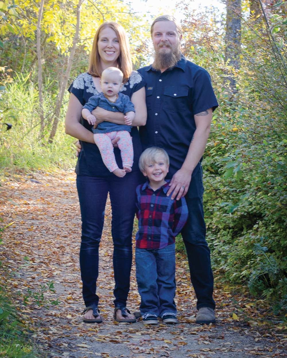 Mike and Amanda and their children Silas and Laurel hope to move to his parents’ acreage soon.