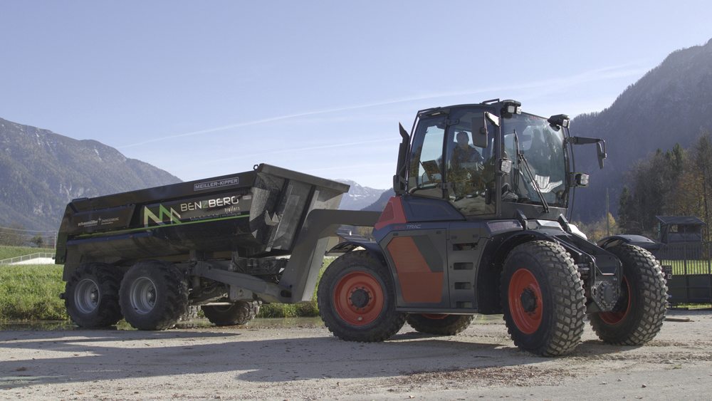 A gooseneck style hitch arrangement transfers some implement or trailer weight to the rear axle.