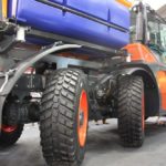 This display model at Agritechnica, with an optional third axle attached, shows the independent suspension and one of three different steering modes.