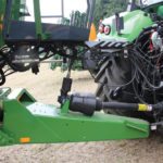 A hybrid drive system with an on-board pump can reduce hydraulic demands on a tractor. 