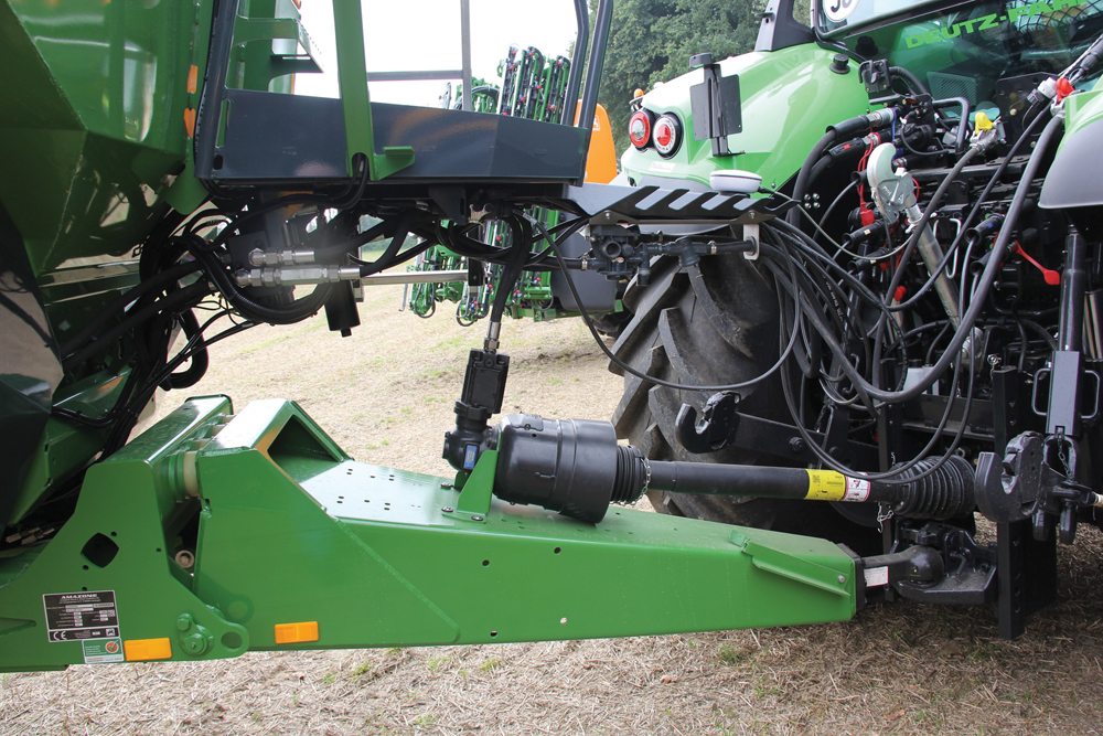 A hybrid drive system with an on-board pump can reduce hydraulic demands on a tractor. 