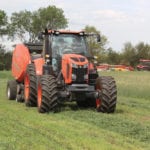 We field-test a pair of Kubota M7 tractors, putting them to work cutting and baling hay in our test field. 