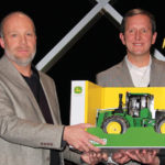 From left to right, Rob Saik, founder and former president of AgriTrend Agrology who created the contest; Merle Klassen, Canola 100 winner; Yancy Wright, senior agronomist with John Deere; and Lander Anderson,
a representative of Cervus Equipment, the John Deere dealer in Trochu, Alta.