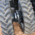 A cast iron spacer improves front axle stability and adds ballast for improved traction.