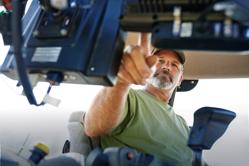 farmer inside tractor cab