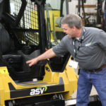 ASV’s Buck Storlie points out the lowered frame at the entrance to the VT-70 High Output, which makes entry and exit a little easier. This improved design will eventually be incorporated into all of the models ASV builds.