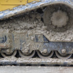 By leaving the interior of the track modules open, the ASV tracks don’t accumulate material under wet conditions. This photo and the next show the build up of mud in a competitive brand while the ASV machine working in the same conditions remains clear.