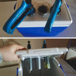 A small plastic cooler and sink drains make a handy and safe holder for materials when vaccinating cattle.