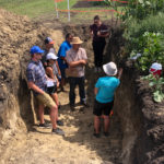 A large on-site hole allowed farmers to get a good look at the soil profile, down more than a metre deep.