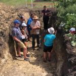 A large on-site hole allowed farmers to get a good look at the soil profile, down more than a metre deep.