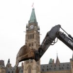 An excavator works on Parliament Hill on the morning of Oct. 22, 2019, the day after the federal election. (Photo: Reuters/Patrick Doyle)