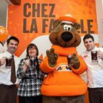 A+W — whose Root Bear mascot is shown here in March 2013, opening the chain’s 100th restaurant in Quebec — booked higher same-store sales in 2013, partly crediting its “Better Beef” campaign. (CNW Group/A+W Food Services of Canada Inc. )
