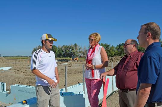 Travis Coleman, DuPont Pioneer research scientist, explains the site of new DuPont Pioneer research facility in Lethbridge, Alberta with Cheryl Dick, Chief Executive Officer, Economic Development Lethbridge, Reeve Lorne Hickey, Lethbridge County and Martin Ebel, Economic Development Officer, Lethbridge County as Pioneer is welcomed once again to the community.
