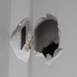 The Manitoba Wildlife Federation points to this bullet hole in a rural northwestern Manitoba home as an example of the risks to the public from unchecked night hunting. (MWF.mb.ca/Nightwatch)