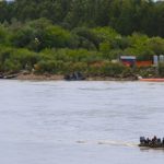 Workers finish a lunch break near the Toby Nollet Bridge and head back out to continue cleaning up the North Saskatchewan, following the Husky oil spill in July. (AGCanada.com Network photo)