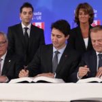 European Commission President Jean-Claude Juncker, Canada’s Prime Minister Justin Trudeau and European Council President Donald Tusk (front, l-r) sign CETA on Sunday in Brussels. (PM.gc.ca)
