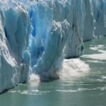 A portion of a melting glacier calves off into the ocean.  Photo: Thinkstock

