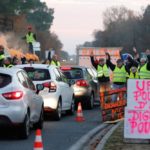 Protesters wearing yellow vests, the symbol of a French drivers’ protest against higher diesel prices, occupy a roundabout in Cissac-Medoc, France on Wednesday. The slogan in pink reads “Urgent, purchase power, dignity for all.” (Photo: Reuters/Regis Duvignau)