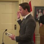 Devin Dreeshen is sworn in on April 30, 2019 as Alberta’s agriculture minister; Premier Jason Kenney looks on. (Video screengrab from Government of Alberta via YouTube)