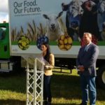 Newfoundland and Labrador’s minister of fisheries and land resources, Gerry Byrne, is shown here at right with Western Agriculture Centre research manager Sabrina Ellsworth and the department’s “Agri-Truck” promotional vehicle at Pynn’s Brook in September 2018. (Gov.nl.ca)