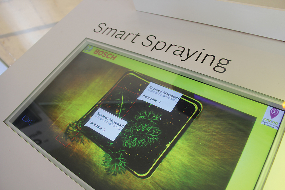 Developed in cooperation with Bosch, Xarvio uses this display with potted weed plants to demonstrate  how the system recognizes a weed then activates a boom nozzle to  spot spray.
