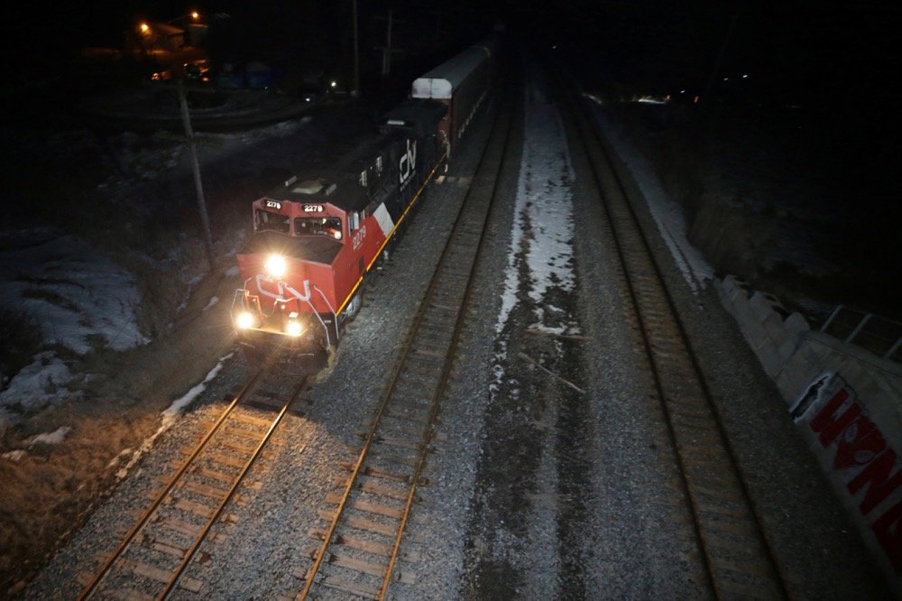 The first CN train passes through the Tyendinaga Mohawk Territory on Feb. 24, 2020 after a camp next to the tracks was raided by police earlier in the day. (Photo: Reuters/Chris Helgren)
