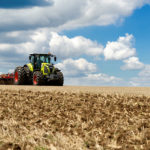 In 2018 Claas introduced its 210 to 290 horsepower Axion 800 Series tractors to Canada. As the brand continues to grow the number of all-Class full-line dealers in North America, it now has even more to offer farmers with the introduction of the Axion 900 Series MFWD tractors. That pushes the brand’s MFWD horsepower range up to 445.
Power for the 900 Series comes from an 8.7 litre FPT (Fiat Powertrain) diesel — the same engine builder supplying Case IH and New Holland equipment — mated to a CVT transmission capable of creeping forward at just 2.7 feet per minute. At the top end the tractors will move down the road at 31 m.p.h. with the engine revving at only 1,750 r.p.m. The engine can run for up to 600 hours between service intervals.
When it comes to hydraulics, the tractors will pump 58 GPM through a standard four SCVs. But that number can be boosted to 6 SCVs. Both front and rear three-point hitches and PTOs are also an option.
Underneath, the 900s are available with the HD PROACTIV suspended front axle that comes equipped with brakes for better control during road transport. A four-point cab adjustable cab suspension is standard equipment to make the ride even smoother, along with an optional heated leather operator’s seat. A cooler inside the cab keeps drinks and food cold through the day. Mounted to the armrest is the brand’s CEBIS information screen.
A telematics package comes standard to help manage machinery functions, which allows for remote diagnostics by a dealer. Also an optional LED package improves vision at night
Aside from the 800 and 900 Series Axion lines, Claas continues to offer its unique Xerion rigid-frame four-wheel drives as well. Available in three models with 435 to 530 horsepower, the Xerions get their power from a 10.6 or 12.8 litre Mercedes Benz diesel engine. That power is routed through a CVT transmission.