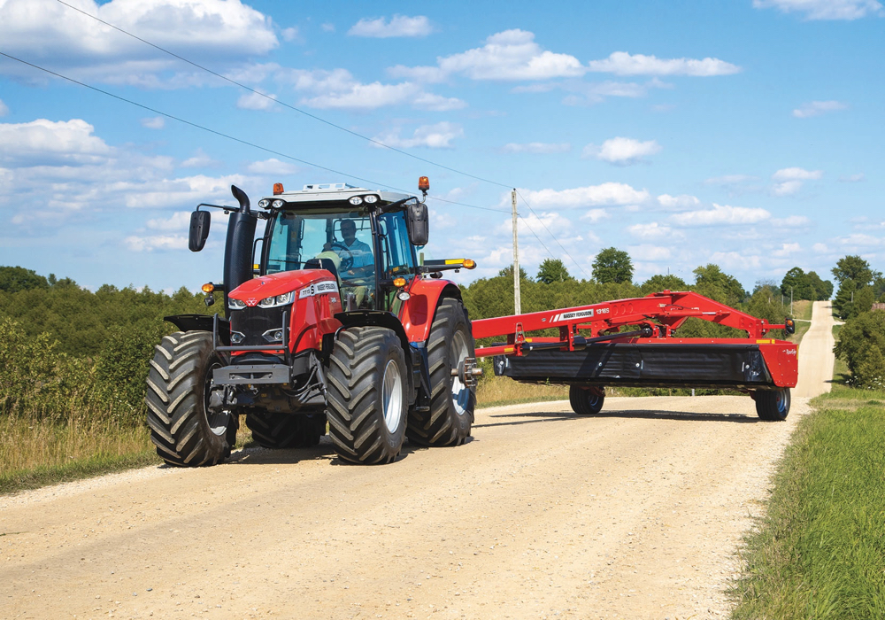 AGCO’s Massey Ferguson brand has pushed at the upper end of its horsepower ratings, too. The 8740S becomes the flagship model of the updated six-model 8700S Series tractor line, and it rates 400 engine horsepower, making it the most powerful tractor to ever wear the Massey name.
The big Masseys rely on an 8.4-litre AGCOPower diesel and route drive through the brand’s 50 km/h-capable Dyna-VT CVT transmission, which uses AGCO’s Dynamic Tractor Management system. It can maintain a pre-set ground speed by adjusting engine power to accommodate changing loads. It also allows on-the-go changes between two cruise speeds. The Dyna-VT has two speed ranges that allows for maximum torque in field operations. Like a lot of transmissions hitting the market now, the Dyna-VT includes a “brake to neutral” feature, allowing the operator to stop the tractor by simply pressing the brake pedal. Release it and the tractor starts off again.
To ensure the transmission isn’t contaminated by trans-hydraulic fluid from an implement, the Dyna-VT uses its own dedicated oil reservoir. A front three-point hitch and PTO are available as an option.
The six 8700S tractors begin at the 270 horsepower mark and increase from there. Below them is the 7700S Series, which offers seven models and two chassis sizes. The large-frame models use either a 6.6- or 7.4-litre diesel mated with the dual-clutch Dyna-6 powershift transmission. The smaller models use the 6.6 mated to either a Dyna-6 or Dyna-4
A couple of years ago, Massey began introducing its “S” Effect models. The existing 7700 and 8700 lines have now been given the same S Effect treatment, hence the S added to the model numbers. S models get updated styling and a range of new options. As part of that an available new LED light package improves night vision. The new styling includes some changes inside the cab as well, which includes updated control layouts.