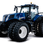 The new Genesis T8 with PLM Intelligence was introduced this year, which mirrors its cousin the Case IH AFS Connect Magnum. It offers features such as advanced connectivity between operators, vehicles, advisors and dealers, which are intended to improve productivity and reduce downtime. There are also customizable controls, improved visibility and enhanced comfort.
The updated cab design offers a more comfortable and convenient driver experience. “Next-generation” controls can be easily customized, allowing every operator to set them up based on their unique preferences and requirements. The new cab features more accessible storage, increased number of power ports and vents, egress lights, and an ergonomic seat for optimal comfort.
Designers have removed obstructions to ensure operators have maximum visibility from the seat. The new InfoView monitor is positioned in direct line-of-sight on the dash, so operators can keep their eyes on the horizon ahead and still see vital readout information. Built-in cameras make it easier to keep an eye on in-field work and other tasks, with one camera in the grille another at the rear cab roof, both with 180-degree vision. Another pair of implement cameras can be mounted lower down on the rear of the cab. New 360-degree LED work lights deliver up to 25 per cent more light to make it easier to see implements when working at night.
Inside the cab, the brand has a new more ergonomic SideWinder Ultra armrest that includes the IntelliView 12-inch monitor, which can handle up to four video inputs.
But the brand claims the most innovative features extend far beyond the cab with complete integration of New Holland’s PLM platform, using ISOBUS CLASS III technology. NH offers the digital MyPLMConnect Internet connection, which allows for data sharing and can include enhanced support functionality through a local New Holland Dealer. This is all done through a simple tablet-based user interface.
The T8 with PLM Intelligence line includes five models from 320 to 435 engine horsepower, plus three more in the SmartTrax configuration.