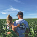Dallas Vert and daughter Tegan check on silage corn, which is an important part of the rotation.