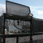 Work lights are revealed when the doors are flipped open on the storage area.