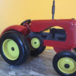 Reg Alspach’s Massey-Harris 55 tractor model is about 6.5 inches wide by 6.5 inches tall and 11 inches long.