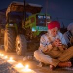 A farmer prays to mark the 551st birth anniversary of Guru Nanak Dev, the first Sikh Guru and founder of Sikh faith, at Singhu border near Delhi on Nov. 30, 2020, at the site of a protest against newly passed farm bills. (Photo: Reuters/Danish Siddiqui)