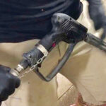Final design has a strap on one wrist attached by a chain to a quick release clip that holds the wand trigger in the “on” position.