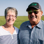 Organic farmer Boyd Charles, pictured here with wife, Gloria, of Stoughton, Sask., says his pelletized and cooked chicken manure packs more fertilizer punch for his grain crops than commercial fertilizer ever could.