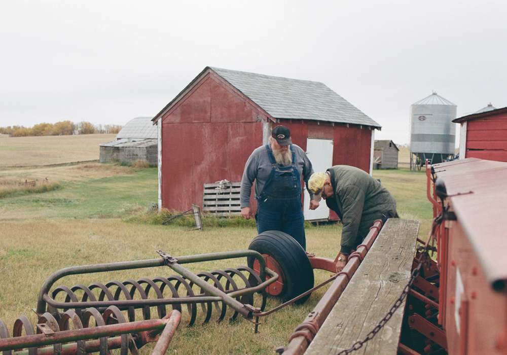 Iver helps me with a few adjustments and repairs on the old discer. This museum piece has been modified to seed salt-tolerant grass.